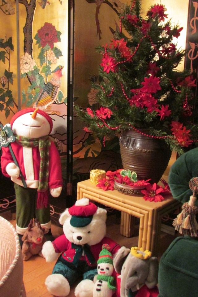 Some holiday characters at the base of the tree.