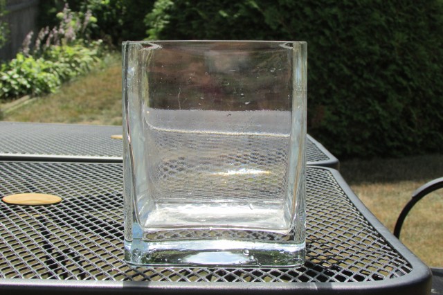 The square, clear glass vase that I used for pool water-loss testing. 